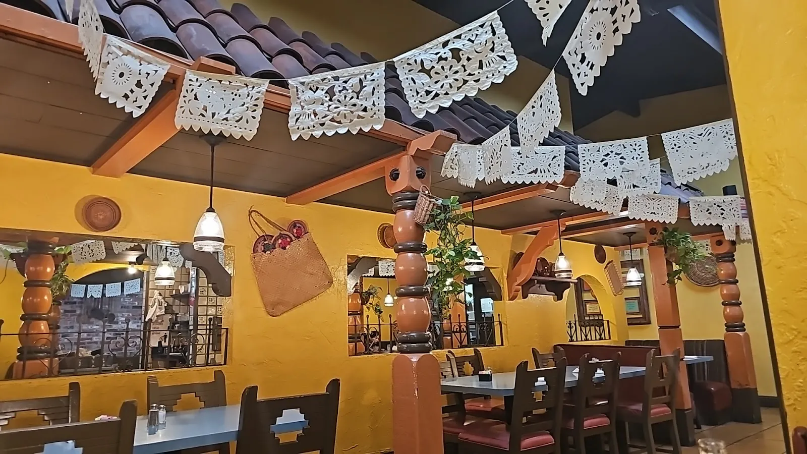 Dining room under strings of papel picado